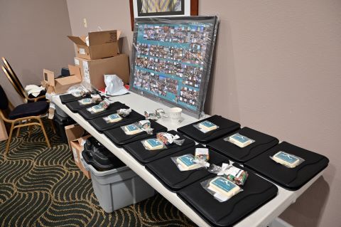 WSF-branded gifts sit on a table next to a collage.