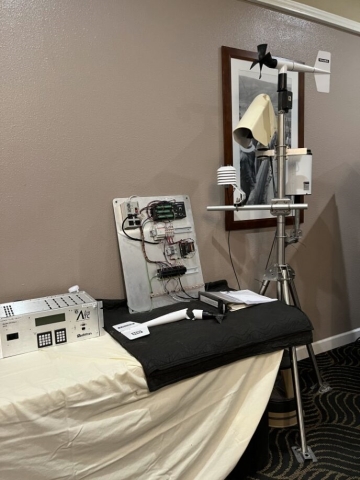 An out of pavement sensor and other equipment are displayed on a table.