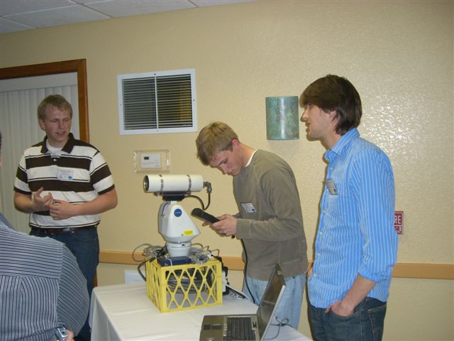 Ryan Huffman and Michael Edwards, Caltrans DRI student research assistants, demonstrate a hand held data terminal they have developed.